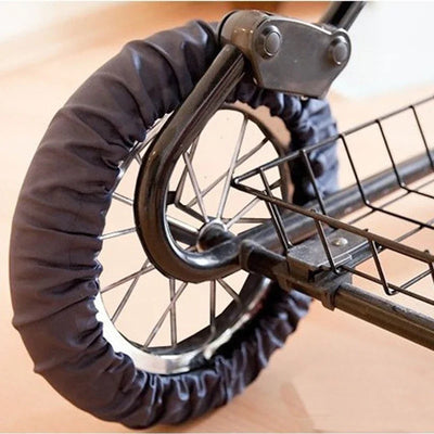 Black wheel cover on a large stroller wheel