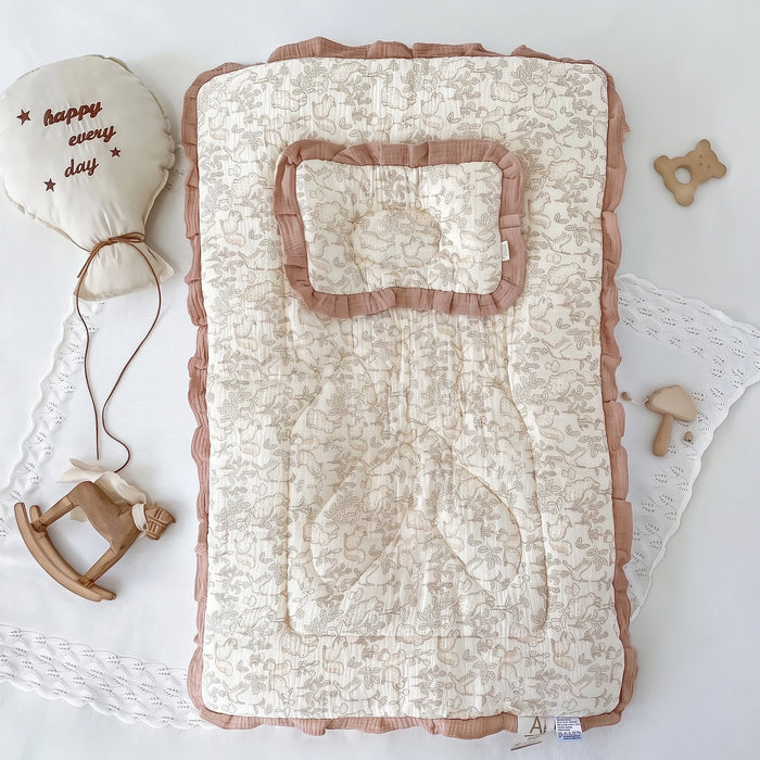 Padded baby floor mat with pillow, squirrel and bunny print