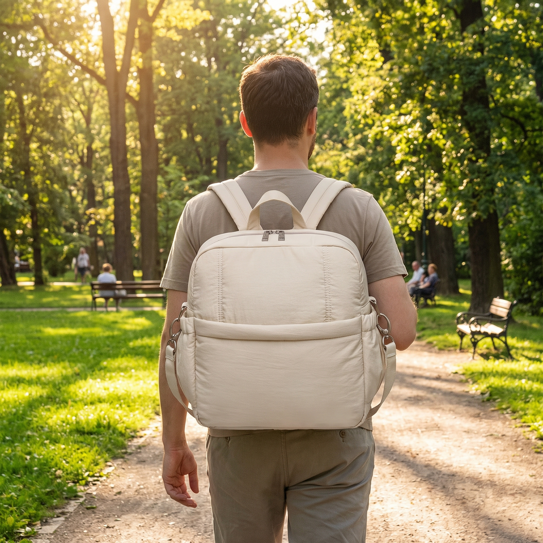 Soboba Diaper Bag Backpack, worn by a parent walking in a park
