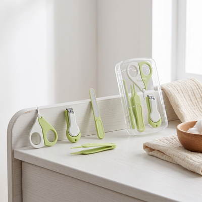 Baby Nail Care Set, in its stand-up holder on a white changing table next to a folded muslin cloth