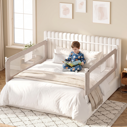 King Size Bed Rail for Toddlers, fitted around a large bed in a calm bedroom, a child reading a book on the bed