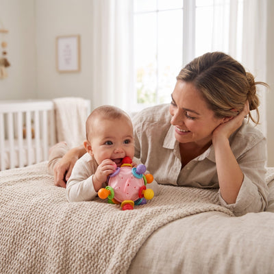 Baby chewing the sensory teething ball